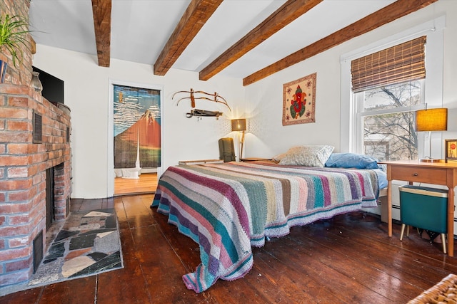 bedroom with a fireplace, access to exterior, hardwood / wood-style flooring, and beamed ceiling