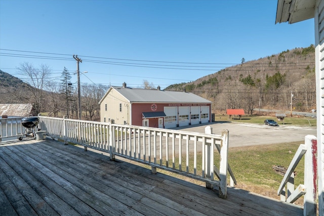 deck with a mountain view and a detached garage