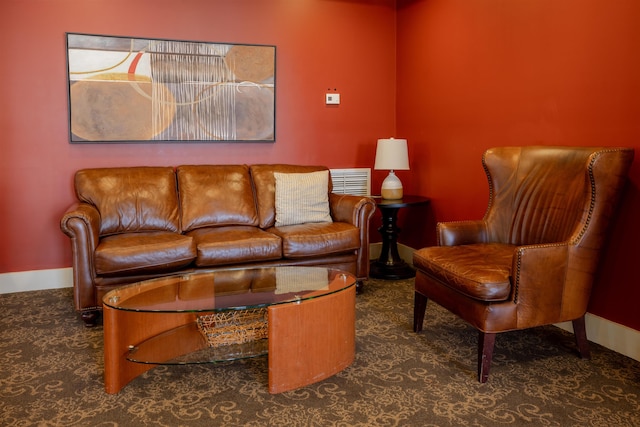 carpeted living room with baseboards