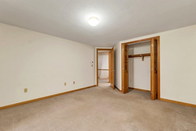11 Harvest Run, Gilford, NH 03249 - unfurnished bedroom with light colored carpet, a closet, and baseboards