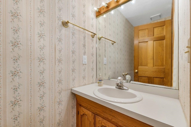 11 Harvest Run, Gilford, NH 03249 - bathroom featuring wallpapered walls and vanity