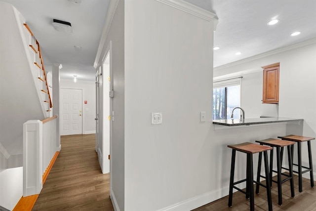 1 Dunvegan Woods Dr, Hampton, NH 03842 - hallway with wood finished floors, a sink, recessed lighting, and crown molding