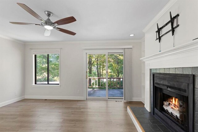1 Dunvegan Woods Dr, Hampton, NH 03842 - unfurnished living room featuring baseboards, wood finished floors, and a fireplace