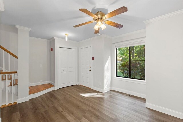 1 Dunvegan Woods Dr, Hampton, NH 03842 - empty room featuring baseboards, wood finished floors, visible vents, and stairway