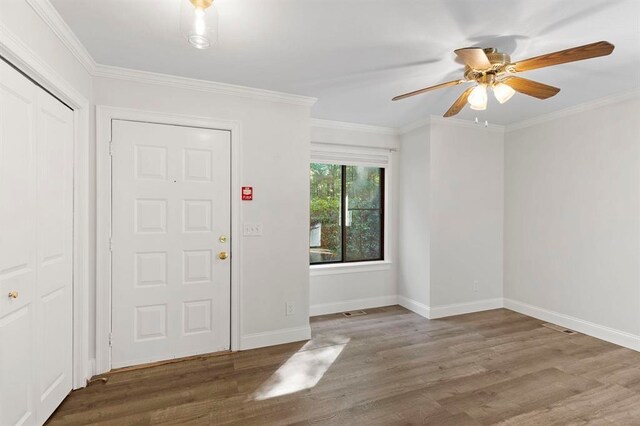 1 Dunvegan Woods Dr, Hampton, NH 03842 - entrance foyer with wood finished floors, a ceiling fan, baseboards, and ornamental molding