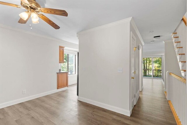 1 Dunvegan Woods Dr, Hampton, NH 03842 - corridor featuring light wood-style flooring, baseboards, and a healthy amount of sunlight