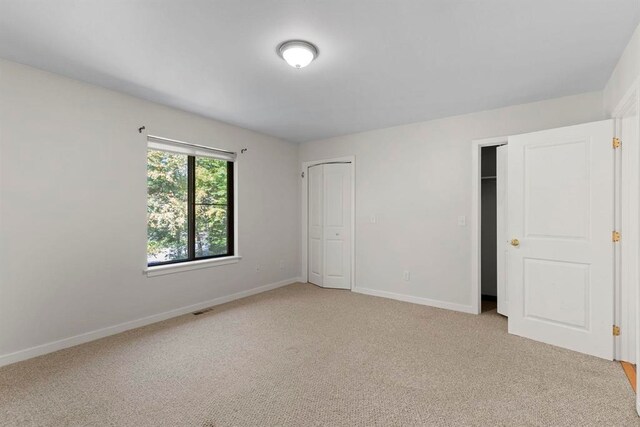 1 Dunvegan Woods Dr, Hampton, NH 03842 - unfurnished bedroom with baseboards, visible vents, and light colored carpet