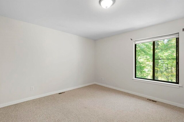 1 Dunvegan Woods Dr, Hampton, NH 03842 - carpeted empty room with baseboards and visible vents