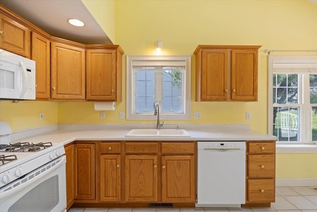 23 Hampton Mdws, Hampton, NH 03842 - kitchen with light countertops, visible vents, a sink, and white appliances
