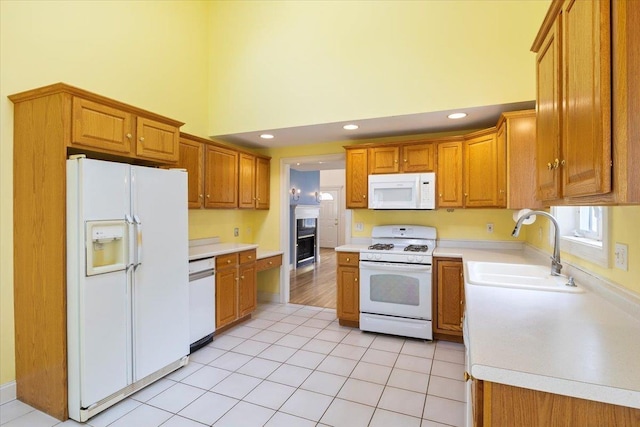 23 Hampton Mdws, Hampton, NH 03842 - kitchen featuring a high ceiling, a sink, white appliances, and light countertops