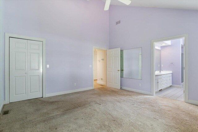 23 Hampton Mdws, Hampton, NH 03842 - unfurnished bedroom with baseboards, visible vents, high vaulted ceiling, and light colored carpet
