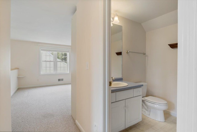 23 Hampton Mdws, Hampton, NH 03842 - bathroom featuring baseboards, visible vents, vanity, and toilet