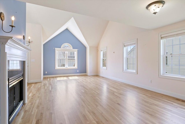 23 Hampton Mdws, Hampton, NH 03842 - unfurnished living room with a wealth of natural light, visible vents, light wood finished floors, and baseboards