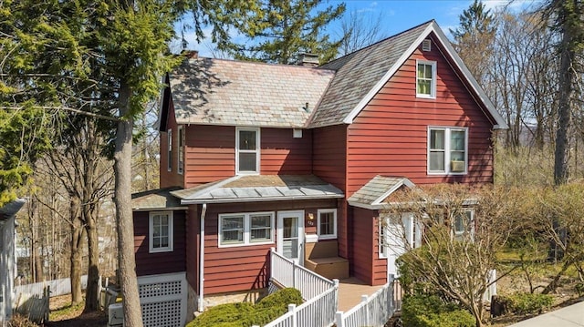 view of front of house with a chimney