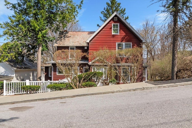view of front of house featuring fence
