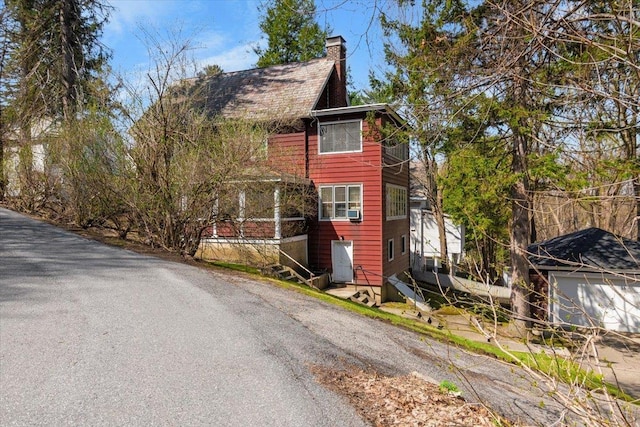 exterior space featuring a chimney