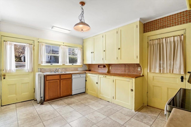 kitchen featuring tasteful backsplash, white dishwasher, a sink, decorative light fixtures, and ornamental molding