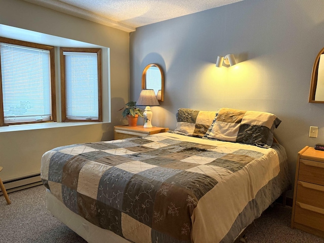 bedroom with carpet flooring and baseboard heating