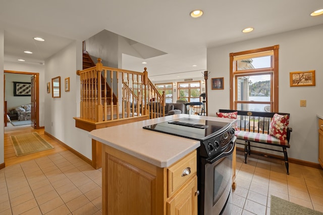 kitchen with range with electric stovetop, recessed lighting, and light tile patterned floors