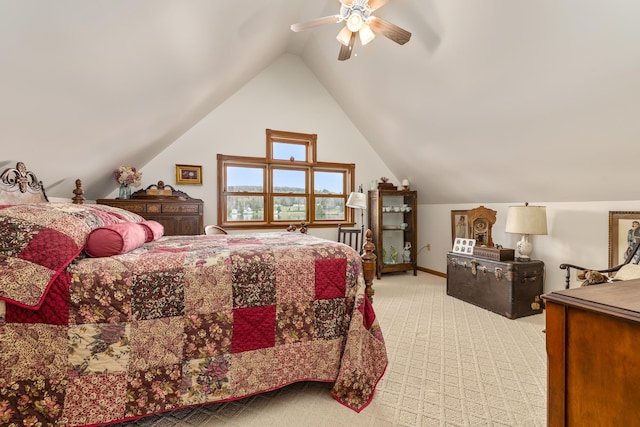 bedroom featuring light carpet, vaulted ceiling, baseboards, and ceiling fan