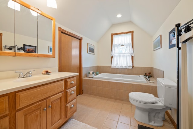bathroom featuring toilet, vaulted ceiling, tile patterned flooring, a garden tub, and vanity