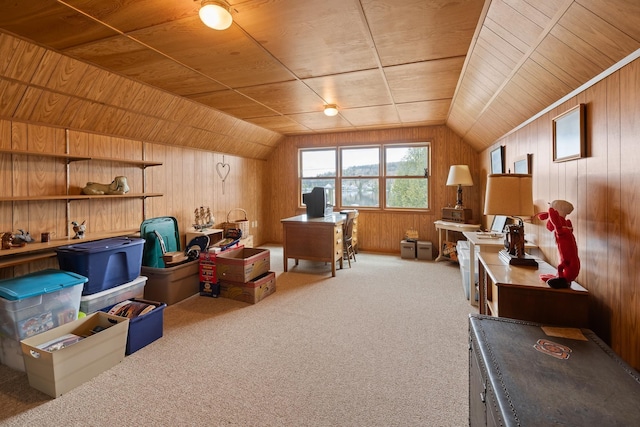 additional living space featuring wood walls, lofted ceiling, and carpet flooring