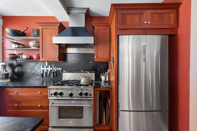 98 Hollis St, Manchester, NH 03101 - kitchen with stainless steel appliances, decorative backsplash, brown cabinetry, and wall chimney range hood