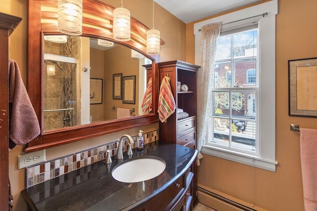 98 Hollis St, Manchester, NH 03101 - bathroom with a baseboard radiator, an enclosed shower, and vanity