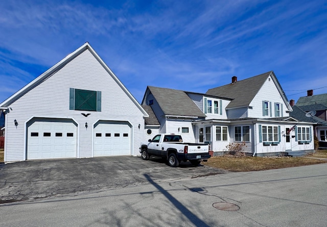 14 Summer St, Northumberland, NH 03582 - view of front of home featuring a chimney and aphalt driveway