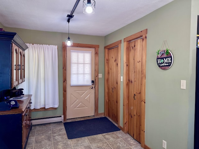 14 Summer St, Northumberland, NH 03582 - doorway with baseboards and baseboard heating