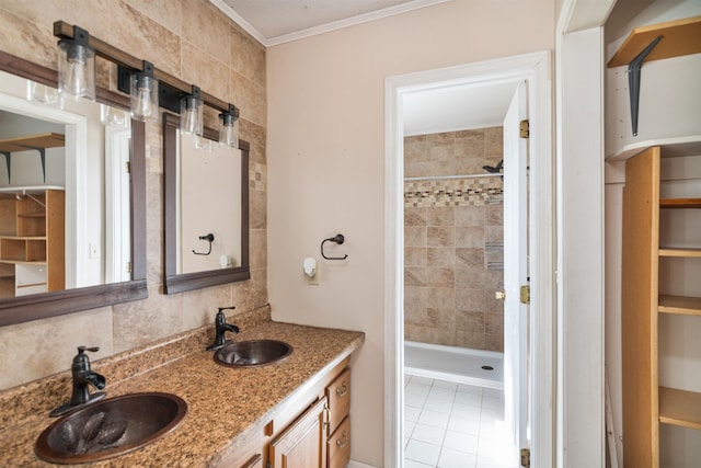 full bathroom with crown molding, a stall shower, decorative backsplash, and a sink