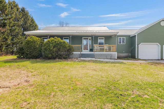ranch-style house with a front lawn, a porch, metal roof, and a garage