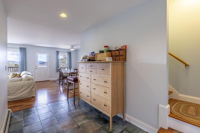 bedroom with baseboards, recessed lighting, dark wood-type flooring, and a baseboard radiator