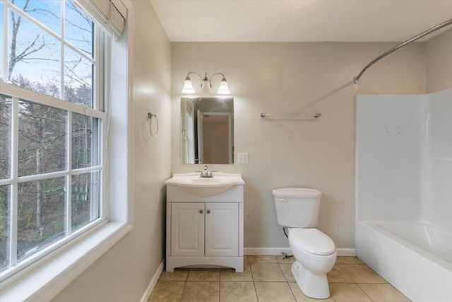 full bathroom with toilet, vanity, tile patterned floors, and baseboards