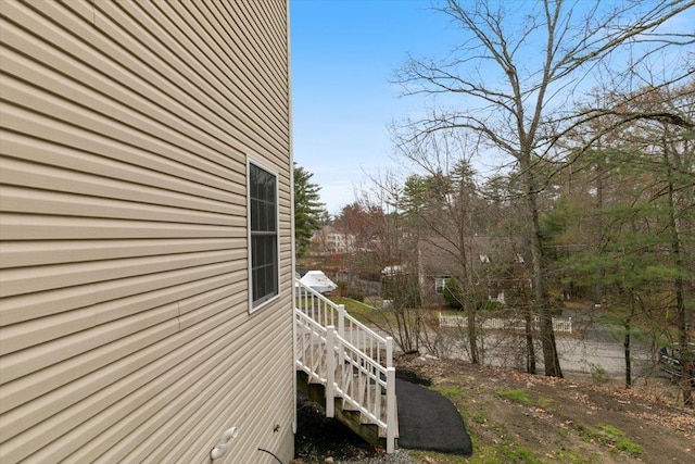 view of property exterior featuring stairway