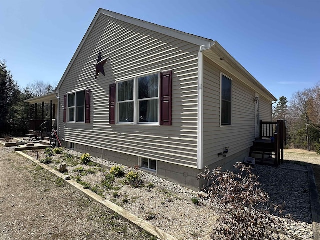 view of property exterior featuring a patio area