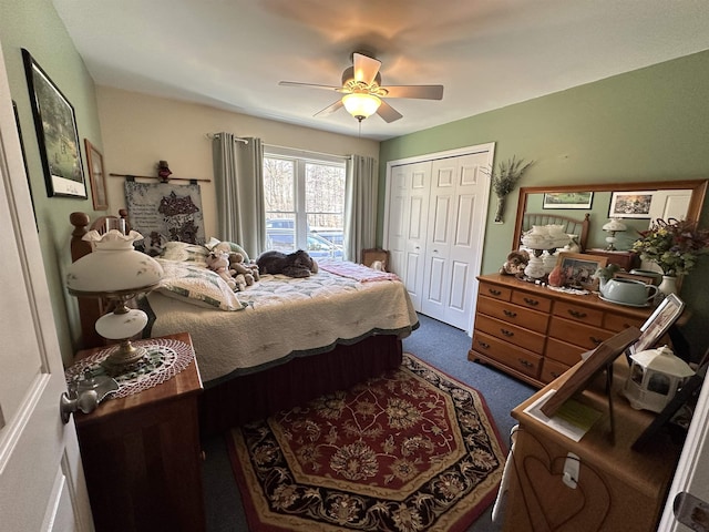 carpeted bedroom featuring a closet and ceiling fan