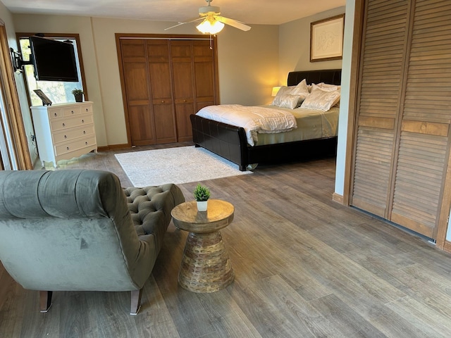 bedroom with light wood-style flooring and a ceiling fan