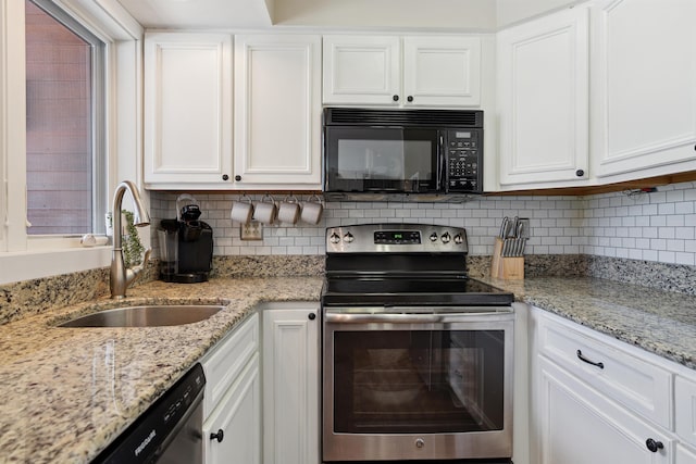kitchen featuring stainless steel electric stove, a sink, white cabinetry, black microwave, and dishwasher