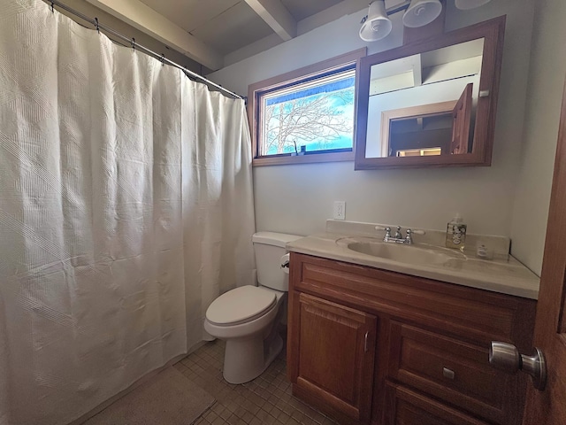 full bath with toilet, vanity, and beam ceiling