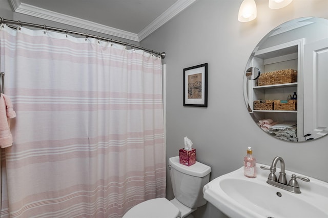 bathroom with curtained shower, a sink, ornamental molding, and toilet