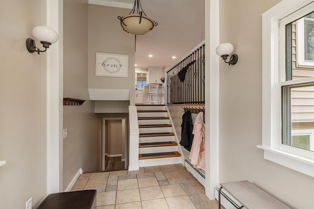 interior space featuring a baseboard heating unit, tile patterned floors, and recessed lighting