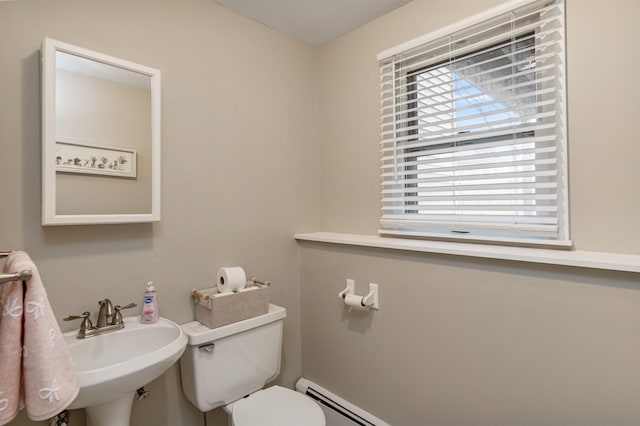 half bathroom with toilet and a sink