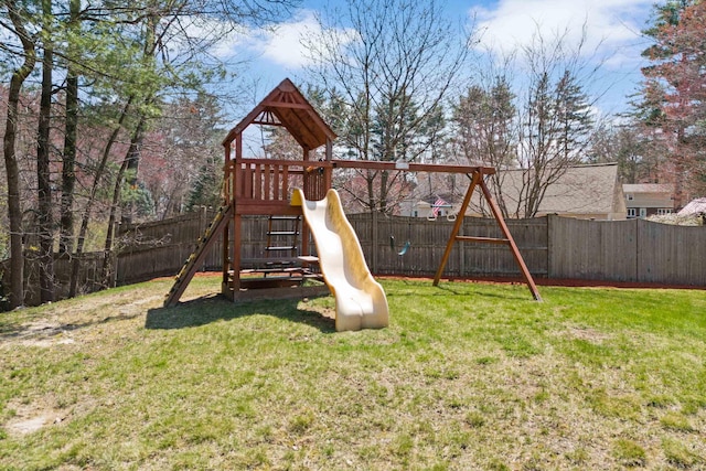 view of play area with a lawn and a fenced backyard