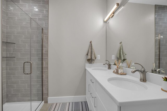 55 Pointe Pl # 207, Dover, NH 03820 - full bathroom featuring double vanity, a stall shower, and a sink