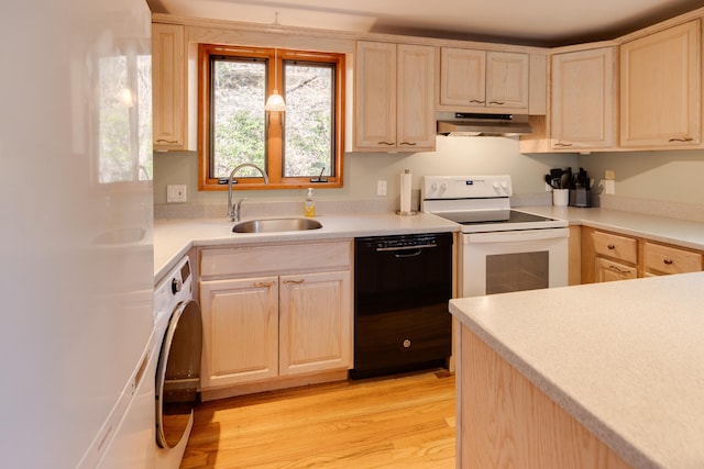 kitchen featuring white electric range, under cabinet range hood, dishwasher, a sink, and washer / dryer