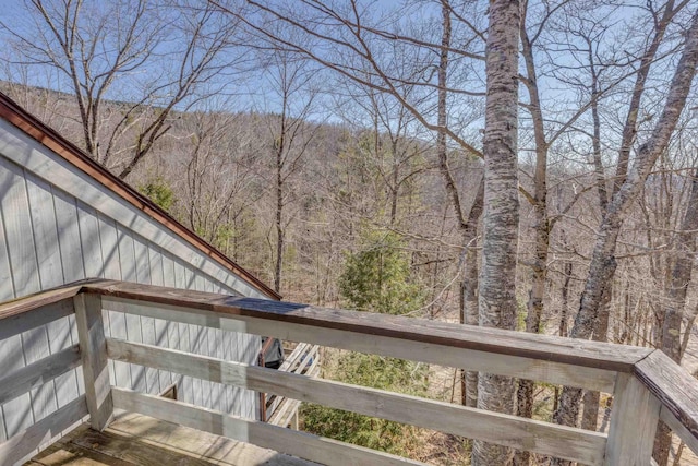 wooden deck featuring a wooded view