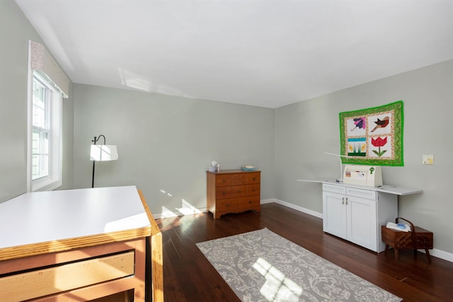 home office with dark wood finished floors and baseboards