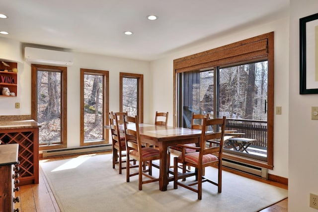 78 Coopers Trce, Plymouth, VT 05056 - dining area with a baseboard heating unit, a wall mounted air conditioner, light wood finished floors, and recessed lighting