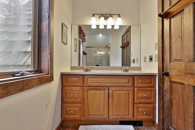 78 Coopers Trce, Plymouth, VT 05056 - full bathroom with baseboards, a sink, double vanity, and a stall shower